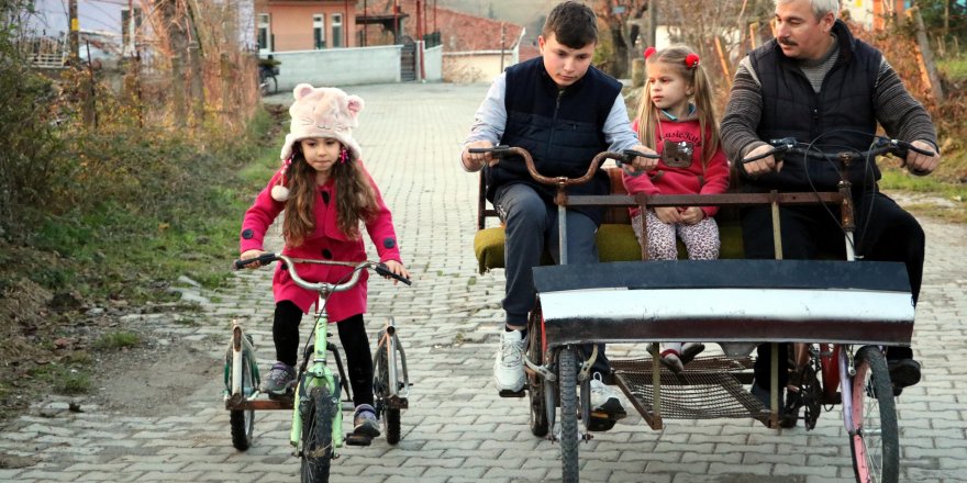 İMAM, ÇOCUKLAR İÇİN ATIK MALZEMELERDEN BİSİKLET YAPIYOR